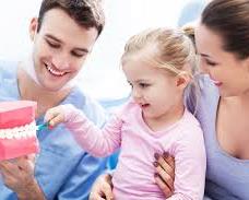 dentist showing dental to baby